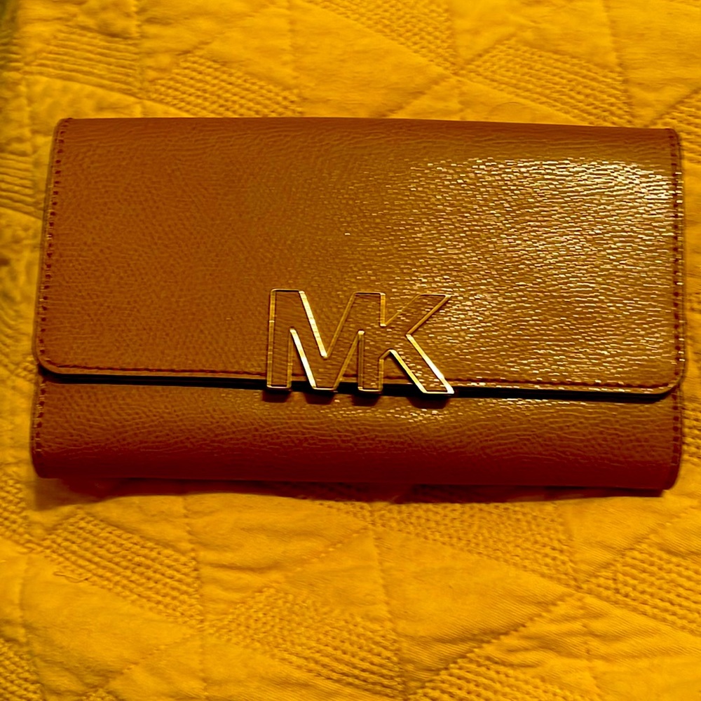 Michael Kors wallets in a beautiful tan color like NEW